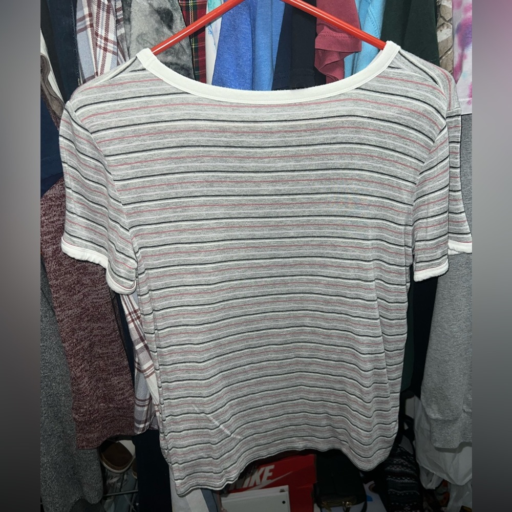 It’s gray and white and red strips it’s a medium